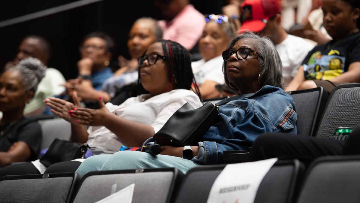 Audience members reacting with emotion during a film